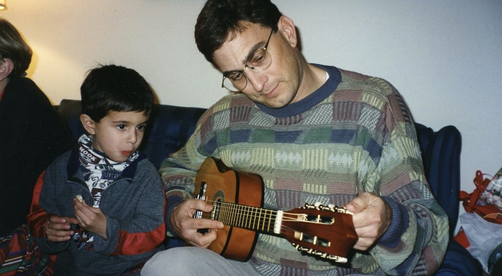 1997: Sharing some guitar playing with nephew Travis.